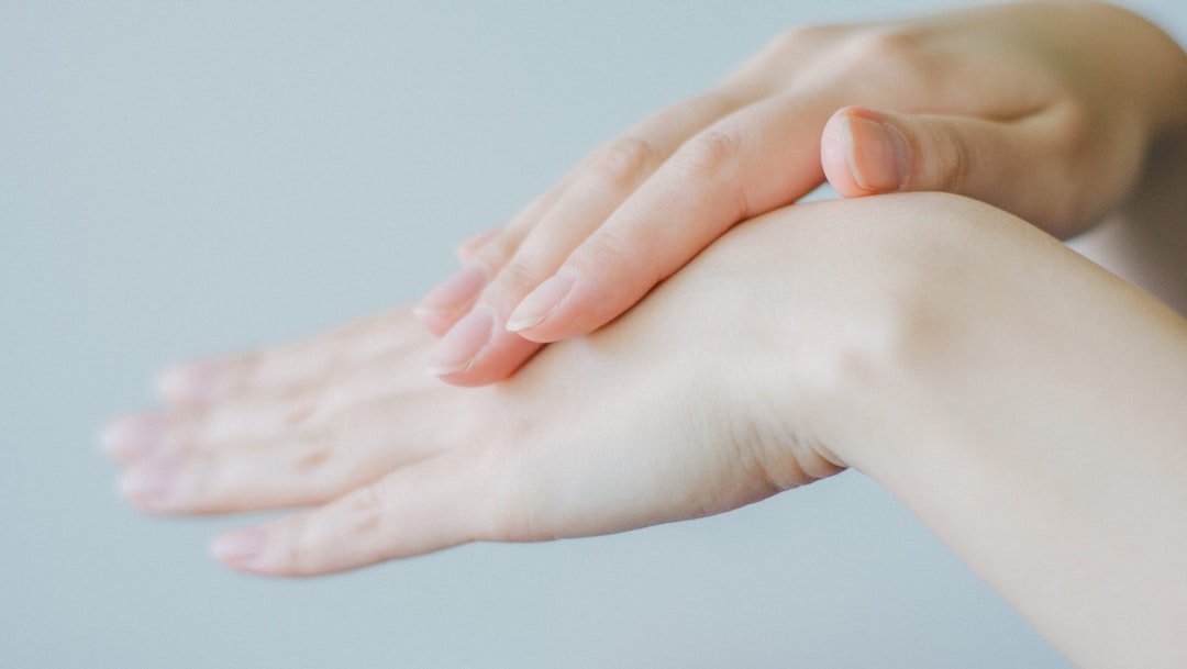 A caregiver gently inspecting the skin of a patient in a comfortable home setting, emphasizing daily care and attention to skin health.