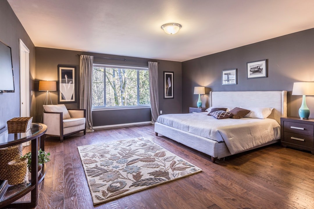 A well-organized bedroom with safety features like grab bars, non-slip rugs, and clear pathways for mobility.